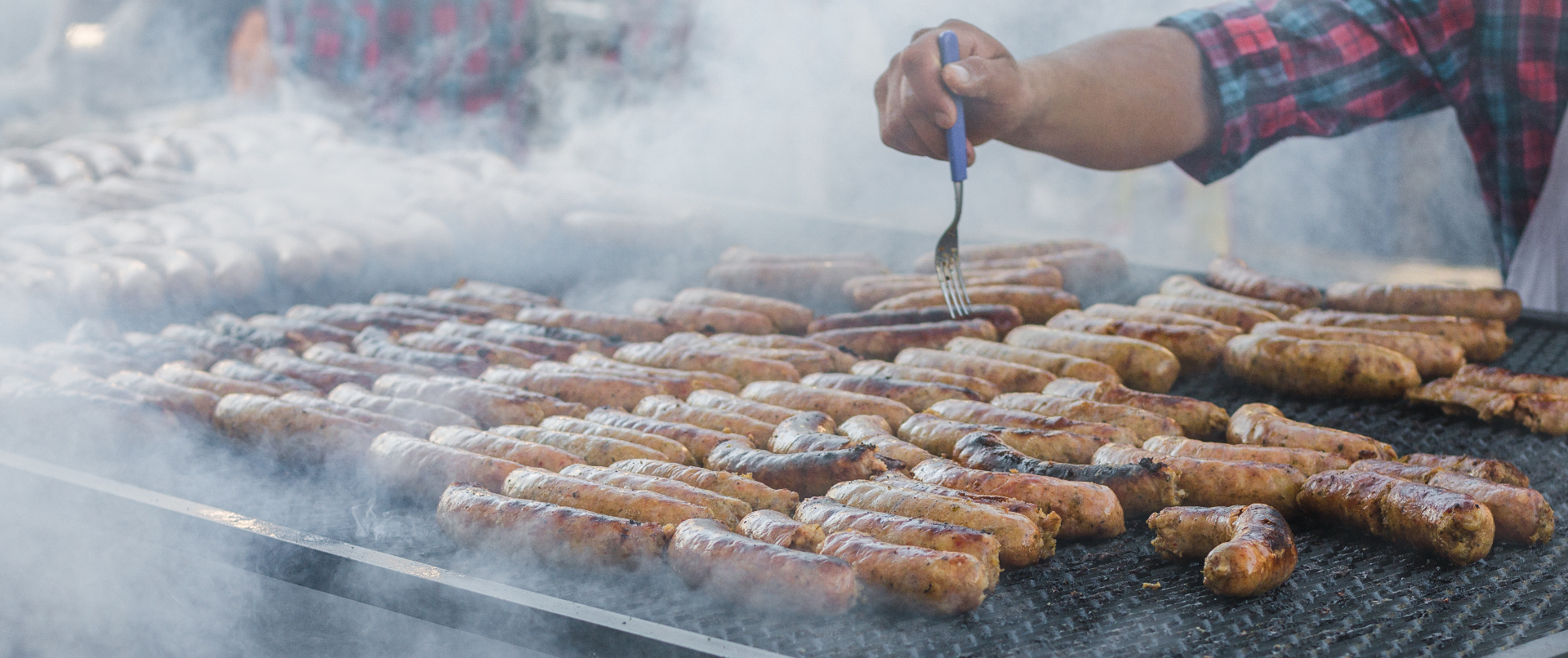 Sausages grilling at a food truck
