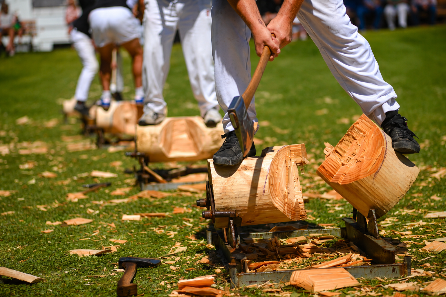 Wood chopping competitor splitting a log with an axe