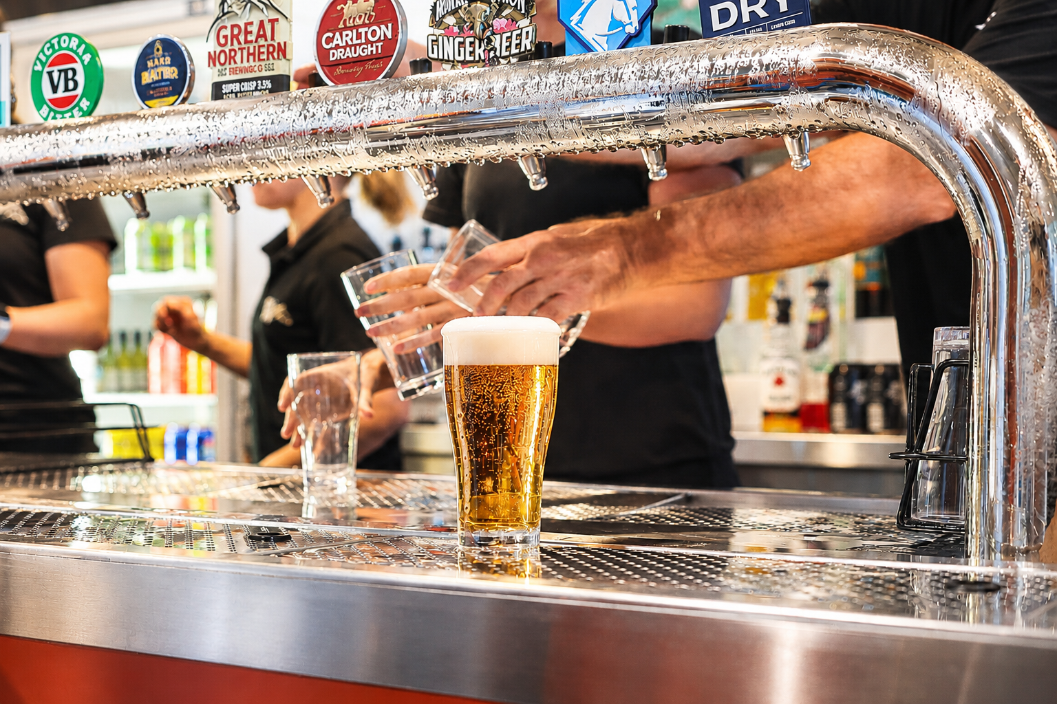 Cold beer being poured at the bar