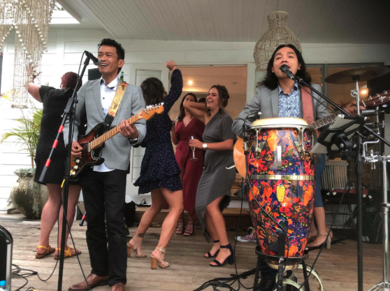 KUTA Groove party band performing live with dancing crowd